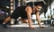 Motivated Muscular Man Making Running Plank Exercise While Training In Gym