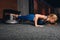 Motivated strong woman doing press-up, push-up