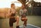 Motivating one another to go further. two attractive young female athletes doing leg raises during their workout on a