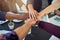 Motivating and strengthening partnerships. Closeup shot of a group of businesspeople joining their hands together in