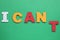 Motivation concept. Changing phrase from I Can\\\'t into I Can by removing paper letter T on green background, top view