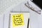 Motivational and inspirational quote written on the adhesive note