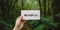 Motivational inspiring hand holding word card mindful in woods