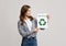 Motivational Placard With Green Recycle Sign In Hands Of Young Woman