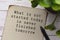 Motivational quote on burnt edge brown paper with blurred green plant