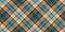 Motley fabric texture of traditional checkered diagonal tartan repeatable ornament, light and dark squares with blue, green