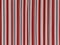 Motley pied red, gray, burgundy, white vertical stripes. Abstract beautiful background. Soft voluminous wavy lines of
