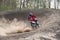 Moto Cross Driver on dusty track - steep turn