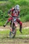 Motocross. The athlete moves on the front wheel of a motorcycle.