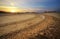 Motocross and auto sport track with sunset sky background.