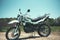 motocross bike stands on a sandy road