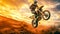 motocross, biker jumps on a dune in the desert at sunset, copy space made with Generative AI