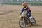 Motocross driver with mounted helmet camera