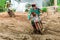 Motocross,enduro rides through the mud with big splash,driver splashing mud on wet and muddy terrain,
