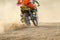 Motocross racer accelerating speed