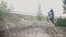 Motocross racer biker in blue jumpsuit jumping on track in rapid shoot, slow motion