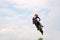 Motocross racer flies amid the clouds