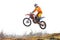 Motocross racer jumping