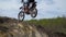 Motocross racer jumping.