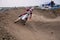 Motocross racer veering with large slope