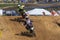 Motocross racers approach jump at spring creek national