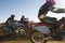 Motocross Racers Racing In Desert