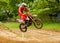 Motocross rider airborne after taking a large jump