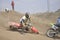 Motocross rider crash, dusty track