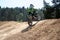 Motocross rider on dirt track