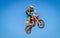 Motocross Rider Jumps high into the Sky