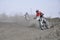 Motocross rider motorbike accelerates from turning