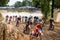 Motocross riders ride on a field for the montgenost championship in France