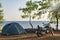 Motor bike and tent at the sea coast