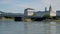 motor boat cruising on Danube near Nibelungen bridge Linz