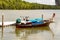 Motor boat moored, sea excursion in the rainforest background