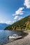 Motor boat moored to the shore of a mountain lake