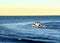 Motor boat in the sea at sunset. Yacht and motorboat on waves in Mediterranean Sea. Skiff and Sailboat in ocean.