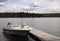 Motor Boat Tied to a Cottage Dock on a Fresh water Lake