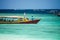 Motor boats carry passengers on the blue sea. The Island Of Gili. Indonesia