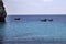 Motor Boats Sailing on the Blue Still Water. Floating Balls in a Line. Tropical Panorama Promoting Natures Beauty