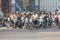 Motor cycle riders wait for green signal at traffic in India