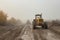 motor grader on the gravel road, october\\\'s overcast, Generative AI