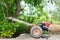 A motor machine of tractor for farmer. Tractor is common for used to describe a farm vehicle that provides the power and traction