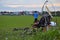 Motor and paraglider engine before flying on green grass, preparing for take-off in the field