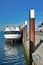 Motor passenger ship `Anna Antal` anchored at dock at harbor Oudeschild on island Texel on a sunny summer day