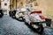 Motor Scooters in an Alleyway in Rome