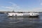 Motor ship `Meteor 143` on the Neva River opposite the Spit of the Vasilyevsky Island in St. Petersburg