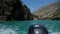 motor speedboats sail along the river along the Sulak canyon