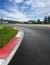 Motor sport circuit asphalt empty track turn and curb surface level view