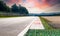 Motor sport circuit asphalt track background curb close up on straight and green field